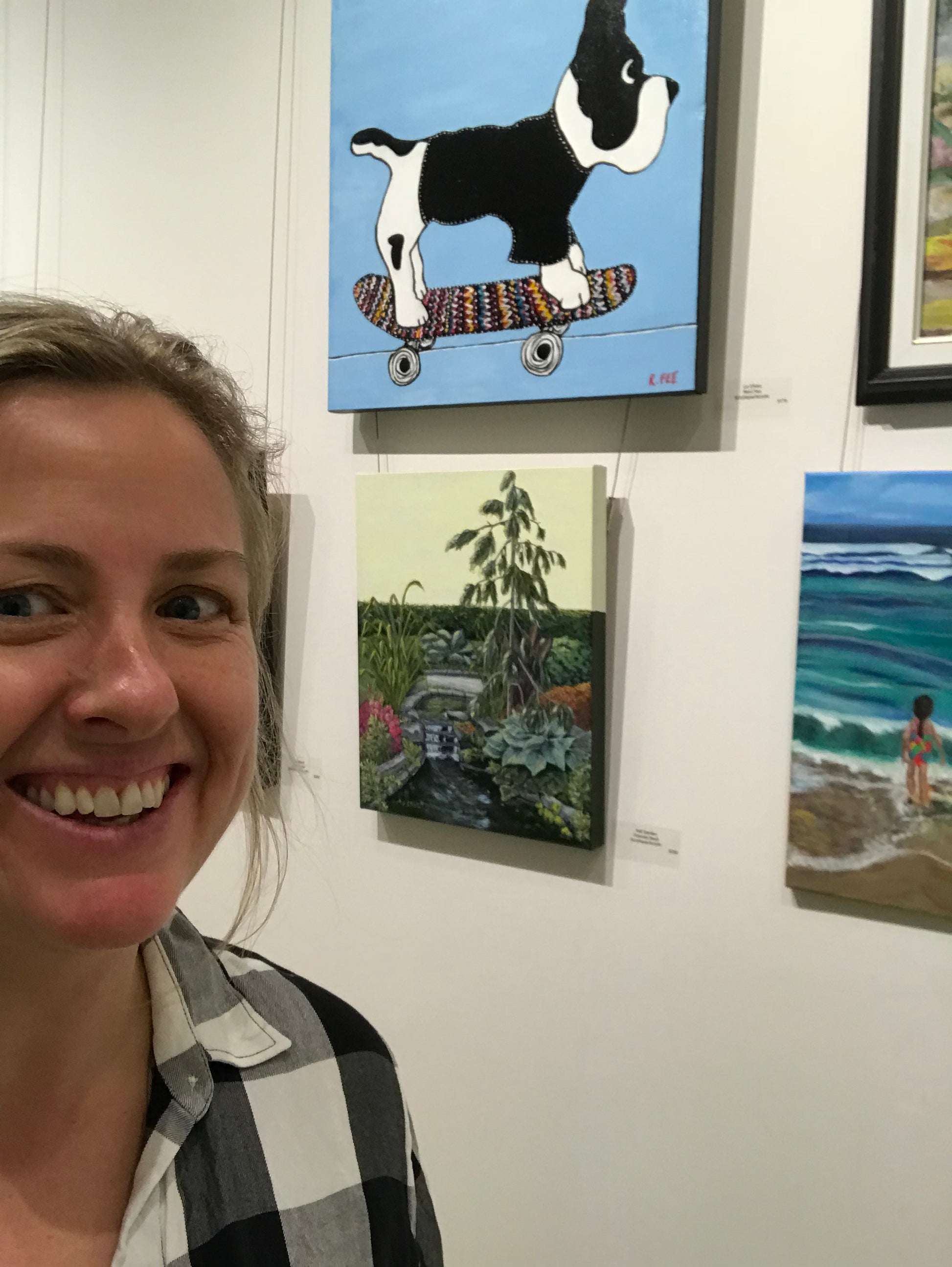 Le Chien - Original Artwork by Reni Fee hanging near the artist herself.